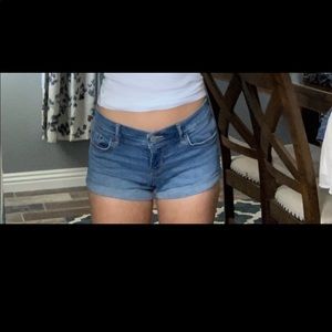 Medium wash low rise denim shorts from Hollister